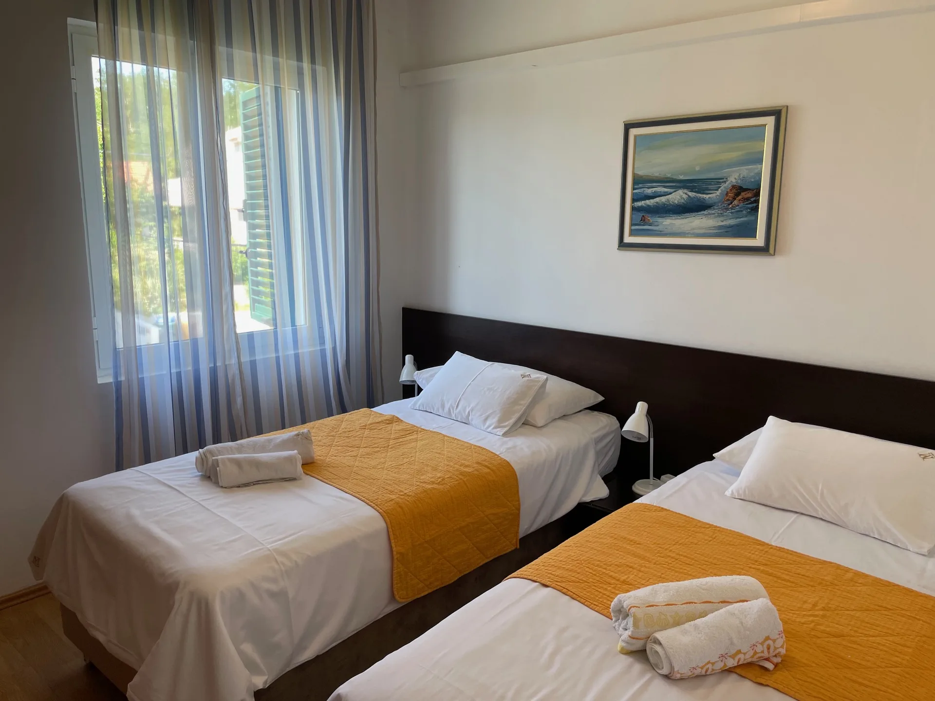 Bedroom with two single beds side by side.
