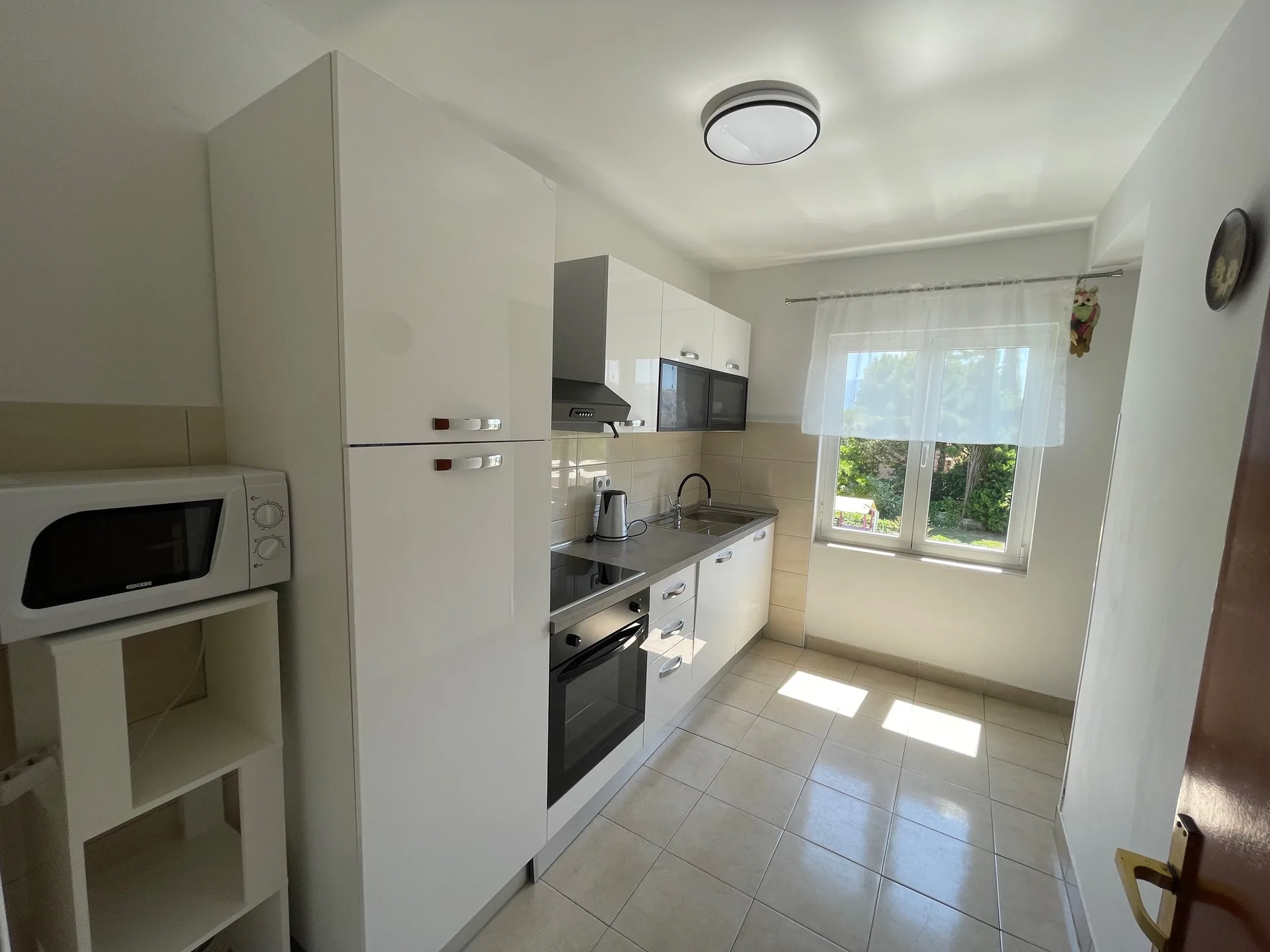 Kitchen seen from the hallway entrance.