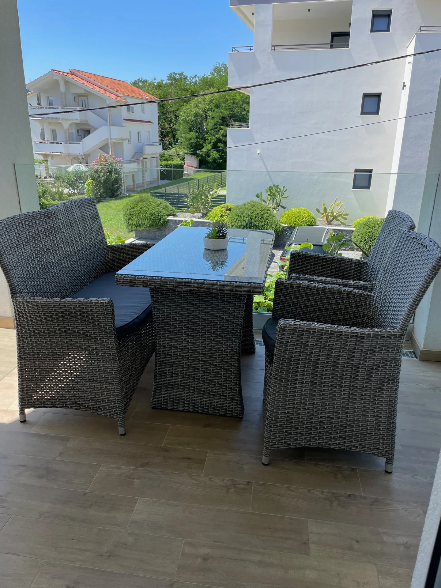 Wicker lounge chairs on the terrace.