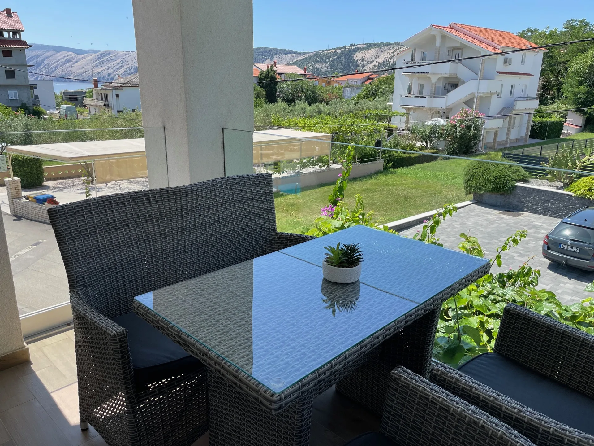Terrace dining table with a sea and mountain view.